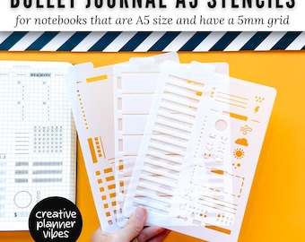 May include: Three translucent plastic A5 stencils for bullet journals featuring various shapes, lines, and icons. The text reads BULLET JOURNAL A5 STENCILS for notebooks that are A5 size and have a 5mm grid and creative planner vibes.