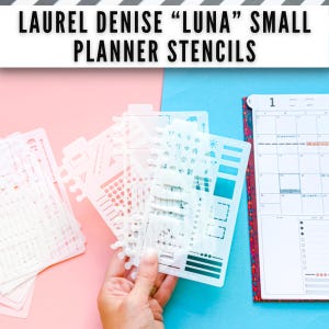 May include: A set of translucent white plastic planner stencils labelled Laurel Denise Luna Small Planner Stencils, featuring various cut-out shapes including weather icons, lines, and boxes, positioned next to a monthly calendar page.