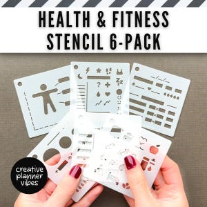 May include: A collection of six white plastic stencils for health and fitness planning. The stencils feature various icons and symbols, including a person exercising, lightning bolts, stars, and hearts. The text "HEALTH & FITNESS STENCIL 6-PACK" is at the top.