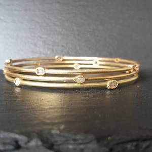 Geelgouden manchetarmband - 18k gouden armband - mooie diamanten armband - stapelbare armband - armband met meerdere diamanten