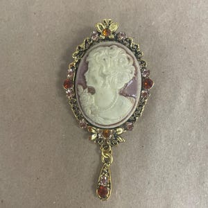Victorian\Gilded Age cameo reproduction. Gold with cream cameo.