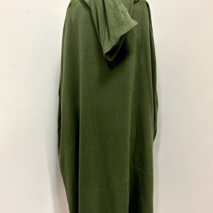 May include: A long, hooded, green robe made of a soft, comfortable fabric. The robe has a relaxed fit and is perfect for lounging around the house.