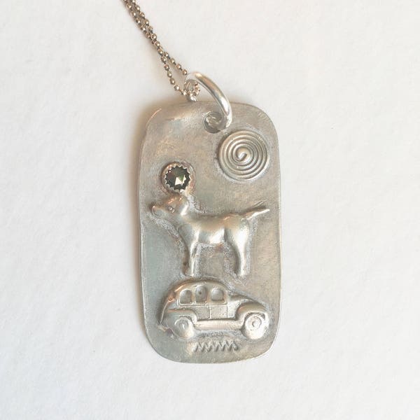 sterling dog tag:  dog and car with brown diamond