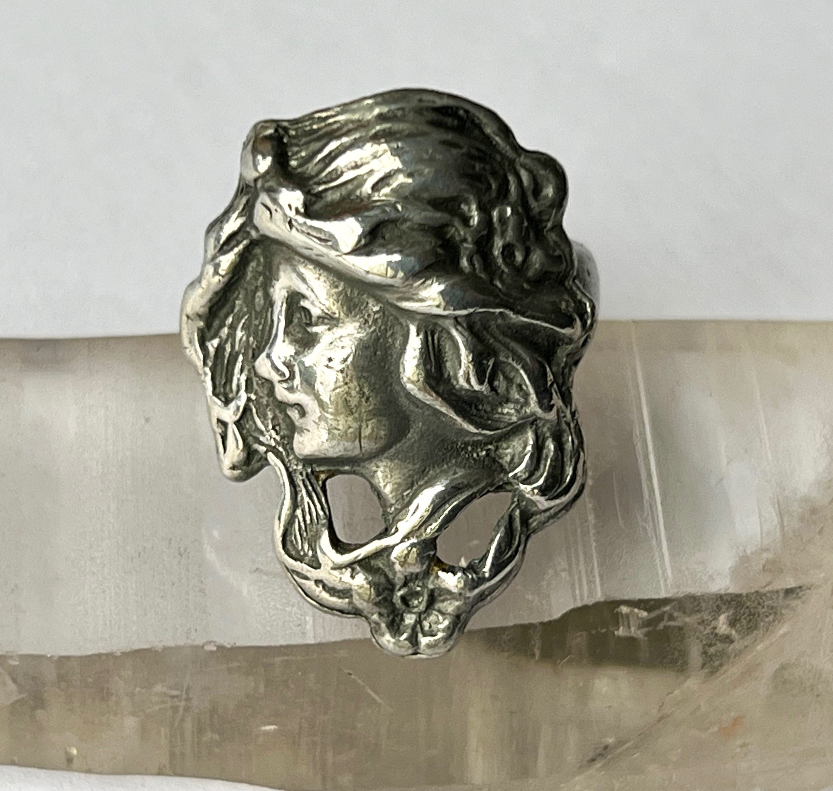 Ring with shop woman's face