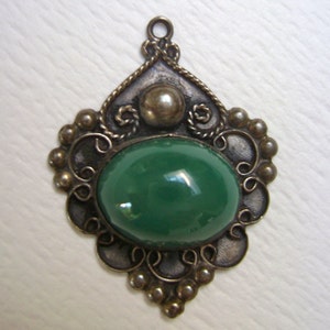 green glass or stone pendant, sterling