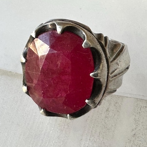 May include: A set of three ceramic mugs with a speckled, matte finish. The mugs are in shades of cream, light gray, and dark gray. Each mug has a simple, minimalist design and a rounded handle.