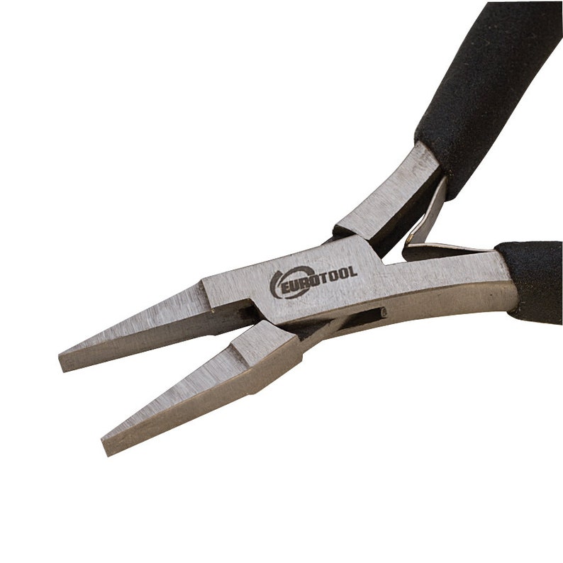 May include: Close-up of a pair of silver-toned pliers with black rubber handles. The pliers have a pointed tip and the word "EUROTOOL" is engraved on the side.