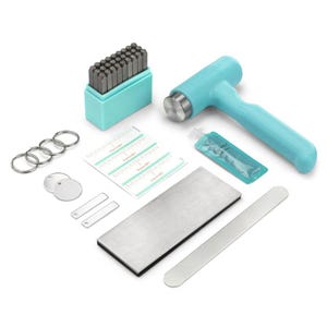 May include: A jewelry making kit with a light blue hammer, a set of metal stamps, and various metal blanks. The kit includes a small tube of lubricant, metal rings, and a metal block. The hammer is approximately 6 inches long.