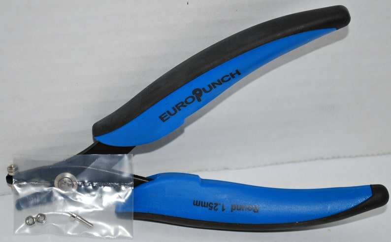 May include: Blue and black hand-held punch tool with a black rubber grip. The tool is labeled "EURO PUNCH" and "Round 1.25mm".