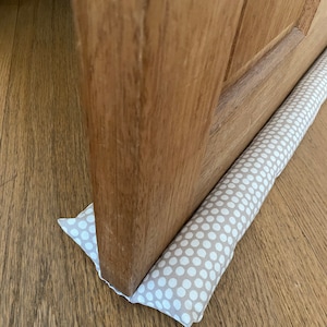 double under door draught excluder, double sided door draft stopper uk, door sausage, draught stopper, door air noise blocker, noise stopper dotty beige