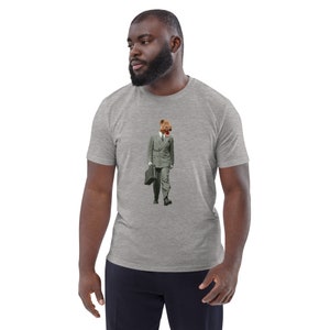 May include: A heather grey t-shirt featuring a graphic of a hyena wearing a suit and carrying a briefcase.