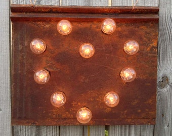 Tin Heart lighted wall art on naturaly rusted antique tin roof panel, carnival light bulbs