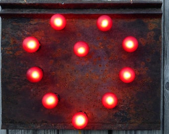 Tin Heart lighted wall art on naturaly rusted antique tin roof panel, carnival light bulbs