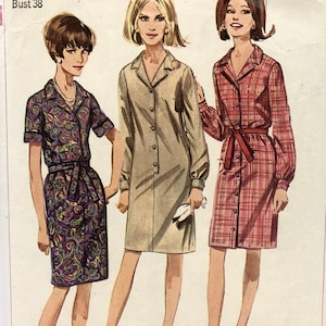 May include: Simplicity sewing pattern number 6698 for a dress. The pattern is for a miss size 18 with a bust of 38 inches. The pattern shows three different styles of dresses, one with a floral print, one with a solid color, and one with a plaid print. The pattern is for personal-fit patterns, which are proportioned to women at the waist and hips.