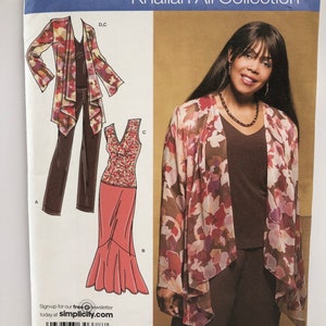 May include: A sewing pattern for a women's outfit, featuring a long-sleeved top with a floral print, a skirt with a ruffle hem, and a pair of pants. The pattern is from the Khaliah Ali Collection and is size AA 10, 12, 14, 16, 18. The pattern is for sizes EUR 36-44 and FR 38-46.