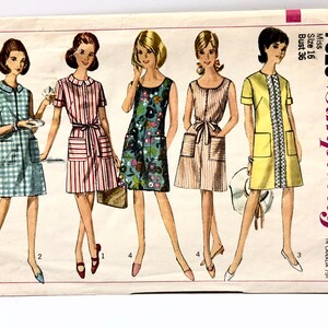 May include: A vintage Simplicity sewing pattern envelope, number 7025, size 16, bust 36. The illustration features five variations of a sleeveless or short-sleeved shift dress with patch pockets, including plaid, striped, floral, and solid yellow designs.