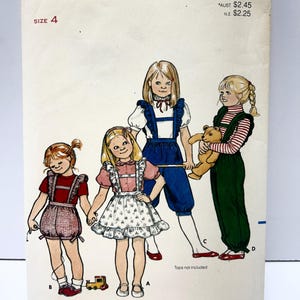 May include: Vintage Butterick sewing pattern 4310 featuring illustrations of four young girls in various outfits. The pattern includes a size 4. The cover is off-white with black text and illustrations.