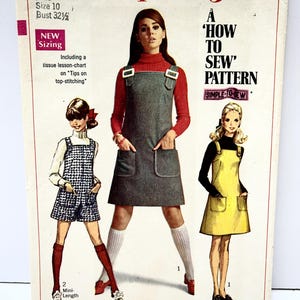 May include: Vintage Simplicity sewing pattern 7877, featuring three women's fashion designs. The pattern includes a mini-length jumper, a jumper with pockets, and a yellow jumper. The pattern is for sizes 10 and bust 32 1/2 inches.