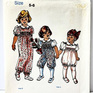 May include: Vintage sewing pattern titled "The Children's Corner Patterns 88" for sizes 5-6. The cover features illustrations of three children in different outfits. The outfits include a jumpsuit, romper, and dress, all with floral patterns. The brand name "Elliott" is printed at the bottom.