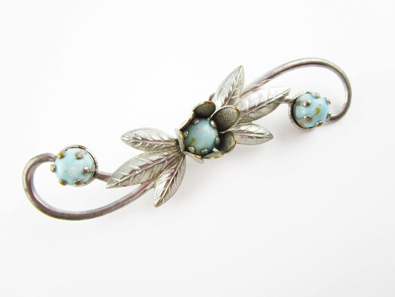 A Silver-toned Punch Metal Pin With Turquoise Sto… - image 1