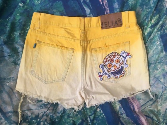 yellow distressed shorts