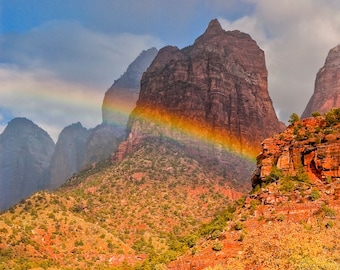 Rare photograph of rainbow in Zion national park canyon.