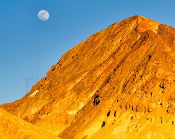 Epic moonrise over golden mountain in Death Valley National Park. Photographed near filming location of Star Wars