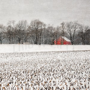 Snowy winter field with red barn in the Brandywine Valley of northern Delaware