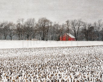 Snowy winter field with red barn in the Brandywine Valley of northern Delaware