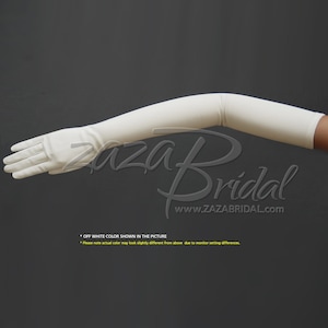 May include: A pair of long, off-white satin gloves. The gloves are shown on a model's arm, bent at the elbow. The gloves extend to the elbow and cover the entire hand. The gloves are smooth and have a slight sheen. * OFF WHITE COLOR SHOWN IN THE PICTURE *Please note actual color may look slightly different from above due to monitor setting differences.