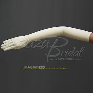 May include: Ivory long satin gloves. The gloves extend to the elbow.  "IVORY COLOR SHOWN IN THE PICTURE" and "Please note actual color may look slightly different from above due to monitor setting differences." are written below the image.