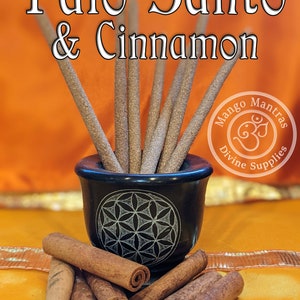 May include: A close-up of Palo Santo & Cinnamon incense sticks in a black bowl with a flower of life design. The sticks are arranged in a fan shape. The bowl is sitting on a yellow surface. The image also includes a pile of cinnamon sticks.
