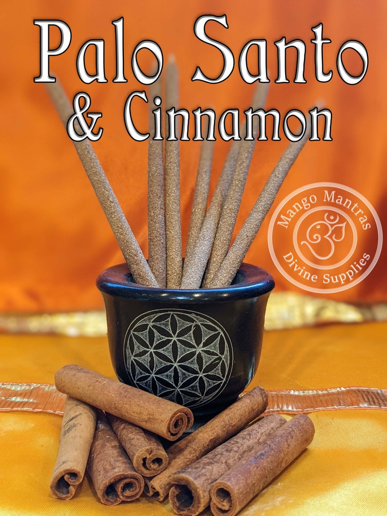 May include: A close-up of Palo Santo & Cinnamon incense sticks in a black bowl with a flower of life design. The sticks are arranged in a fan shape. The bowl is sitting on a yellow surface. The image also includes a pile of cinnamon sticks.