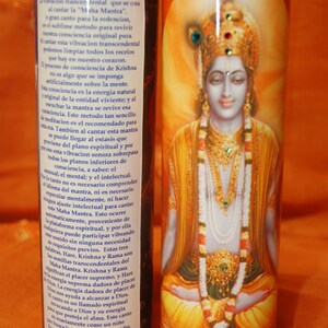 May include: A colorful candle with a picture of Krishna, a Hindu deity, on the front. The candle has text on the side that reads "Hare Krishna, Hare Krishna, Krishna Krishna, Hare Hare, Hare Rama, Hare Rama, Rama Rama, Hare Hare."