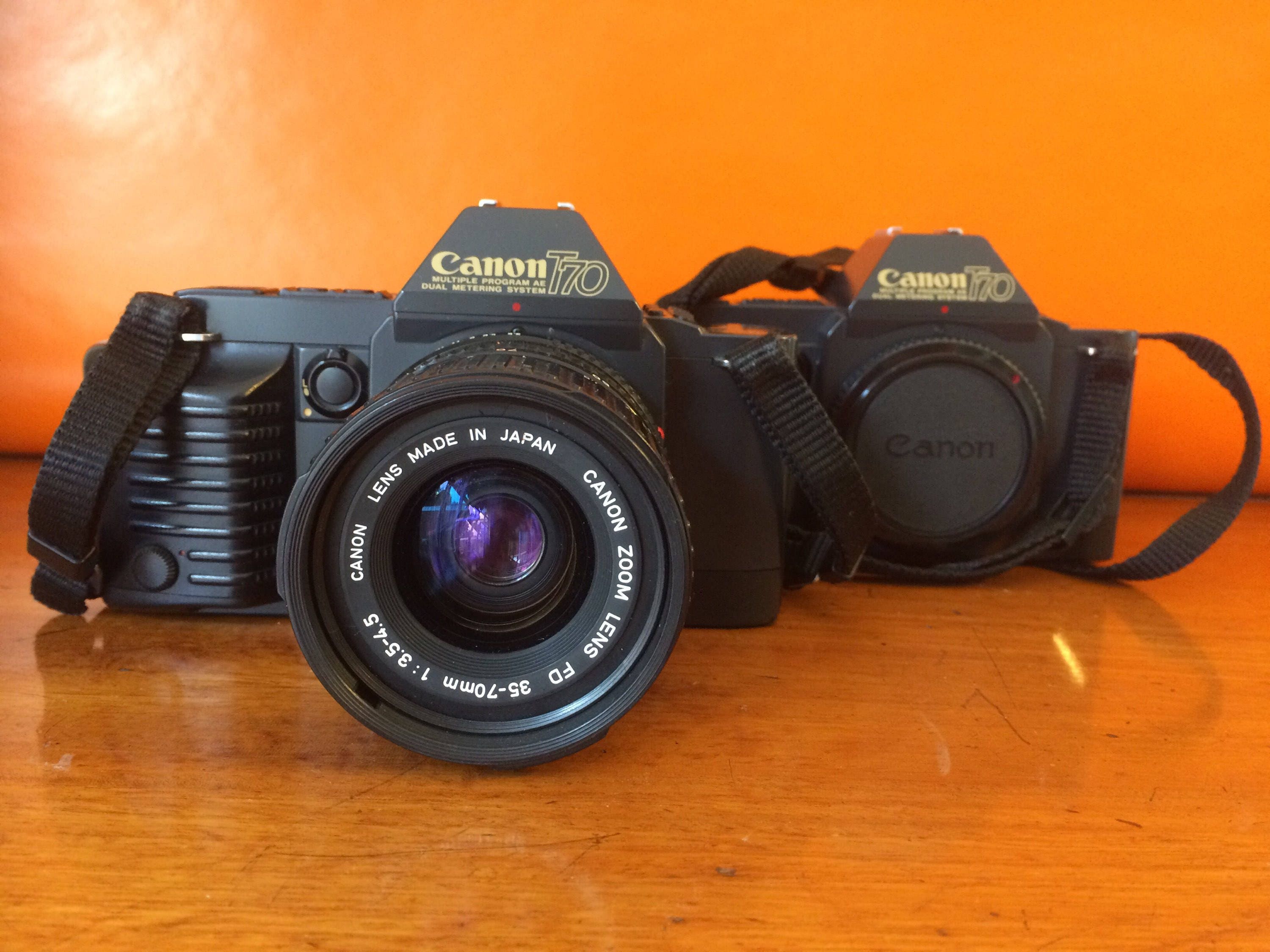 Canon T70 vintage SLR camera 2 bodies 4 lenses and