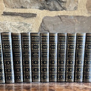 May include: A collection of twelve vintage "World Epochs" books. The books have black covers with gold lettering and decorative accents. The spines display the series title and volume numbers.