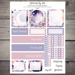 May include: A sheet of planner stickers with a watercolor design. The stickers feature floral and celestial elements in shades of purple, pink, and white. Text includes "Habit Tracker", "This Week", "To Do List", "Weekly Tracker", "Shopping", "Payday", "Day Off", and "Groceries".