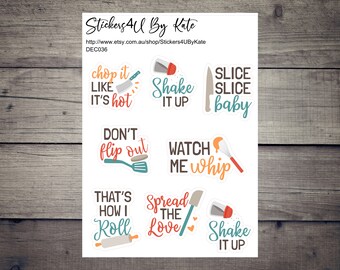 May include: A set of eight white stickers with colorful illustrations and text. The stickers feature kitchen-themed phrases like "chop it like it's hot", "shake it up", "slice slice baby", "don't flip out", "watch me whip", "that's how I roll", "spread the love", and "shake it up".