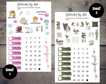 May include: Two sheets of stickers with a pink and green color scheme. The first sheet features a calendar with days of the week and numbers 1-31. The second sheet features a calendar with days of the week and numbers 1-31. Both sheets have a variety of stickers with illustrations of home-related themes, including a house, a cup of coffee, a book, and a plant.