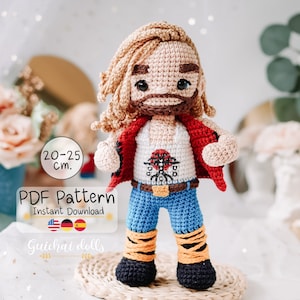 May include: Crochet pattern for a 20-25 cm tall amigurumi doll. The doll is wearing a red jacket, a white tank top with a graphic design, blue jeans, and orange and black striped boots. The pattern is available as an instant PDF download.  PDF Pattern Instant Download.