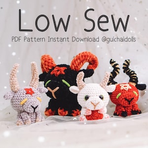 May include: Four crocheted goat dolls in various colors: lavender, black, white, and red. Each doll has horns and a star on its forehead. The text "Low Sew" and "PDF Pattern Instant Download @guichaidolls" are displayed above the dolls.