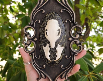 Black filigree wall plaque with squirrel skull, animal skull art