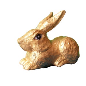 The wooden rabbit figurine handcarved in wood