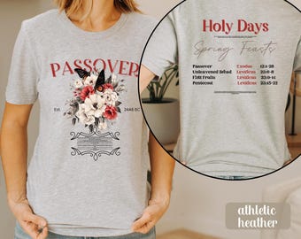 May include: Gray t-shirt with a floral design and the word "PASSOVER" printed on the front. The back of the shirt lists "Holy Days Spring Feasts" with a list of Jewish holidays and their corresponding scripture references.