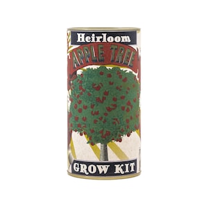 May include: A cylindrical grow kit for an apple tree. The kit features a vintage-style design with the words "Heirloom Apple Tree" in a banner across the top. The image shows a tree laden with red apples. The words "Grow Kit" are at the bottom.
