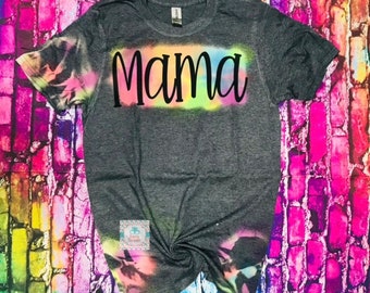 May include: Gray tie-dye t-shirt with the word "Mama" in black lettering on the front.