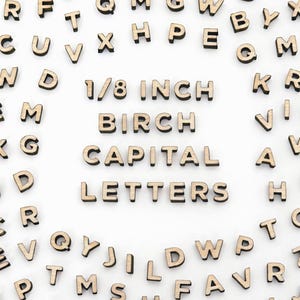 May include: Wooden capital letters, 1/8 inch in size, scattered on a white surface. The text "1/8 INCH BIRCH CAPITAL LETTERS" is displayed. Ideal for crafts, scrapbooking, and educational projects.