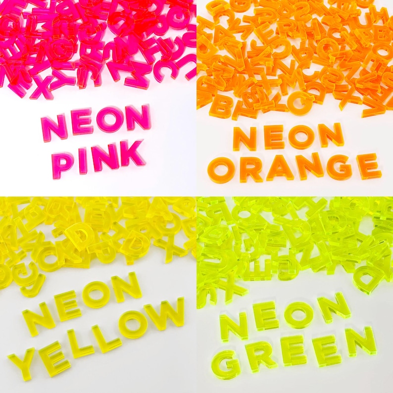 May include: Assortment of neon alphabet letter tiles in pink, orange, yellow, and green. The letters are arranged in a grid with the words "NEON PINK", "NEON ORANGE", "NEON YELLOW", and "NEON GREEN" spelled out below each color.