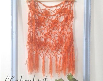 crocheted poncho in burnt orange