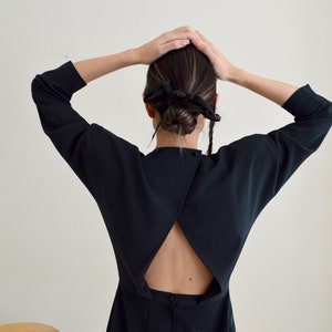 structured cut out back black mini strong shoulder dress image 1